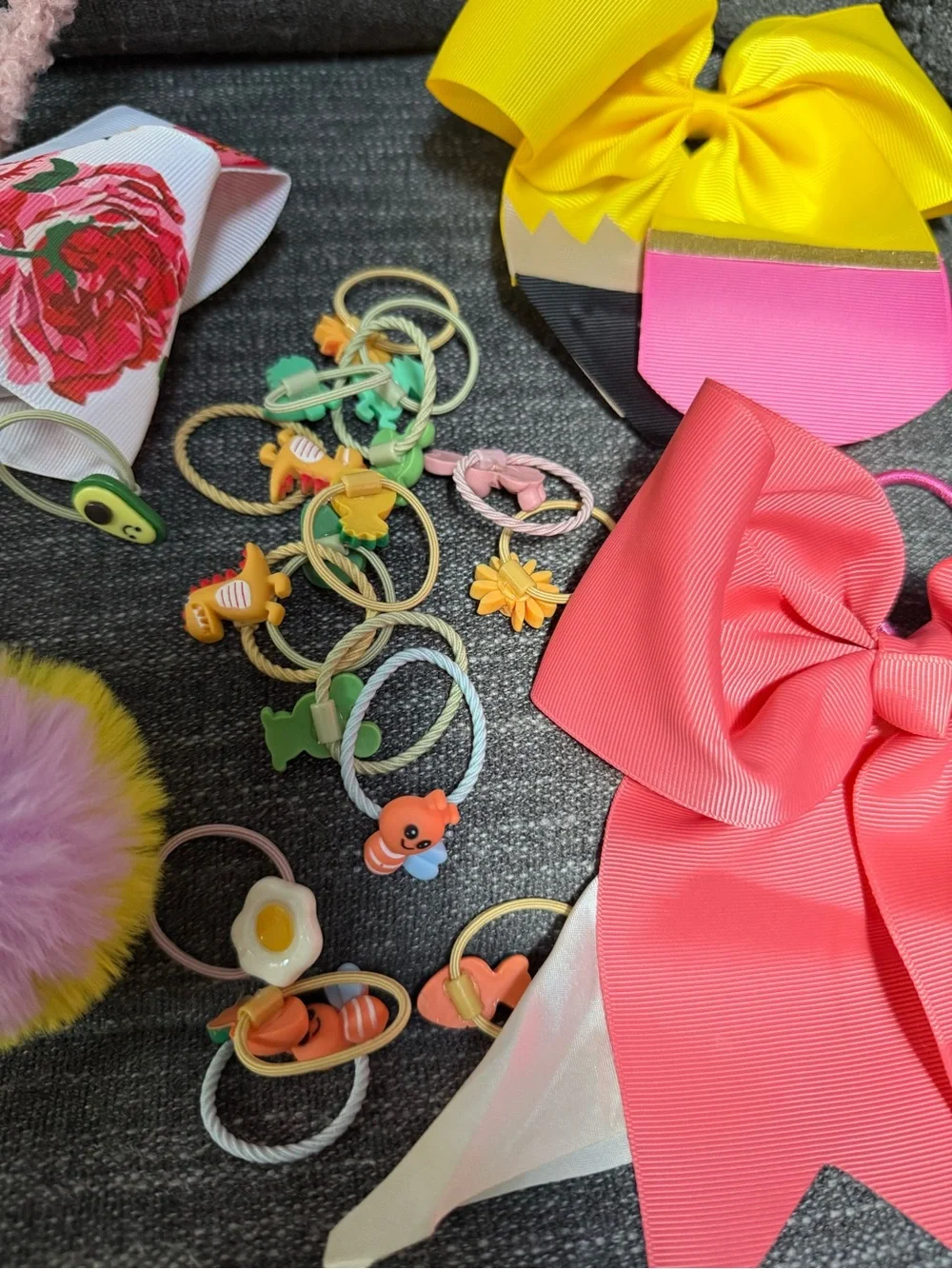 Bundle of girls hair accessories and a small little girls purse.